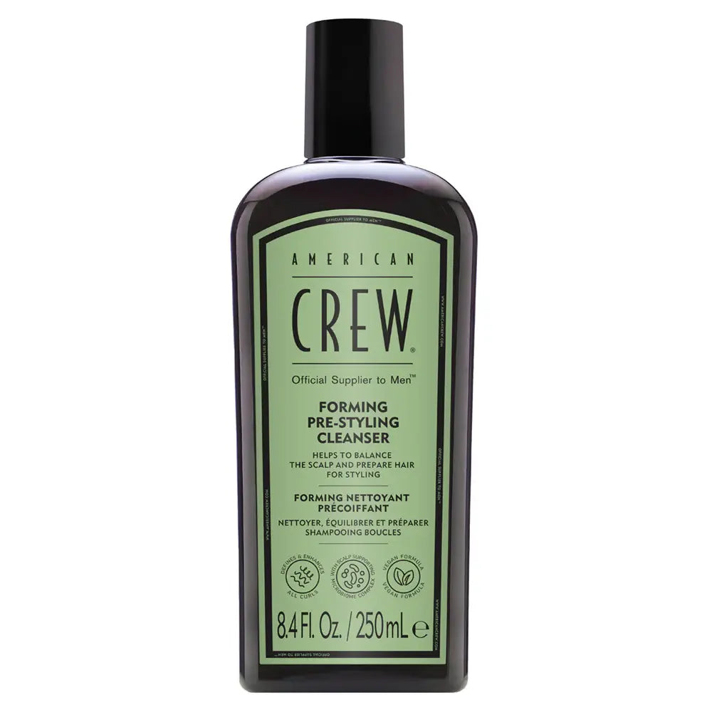 American Crew shampoo bottle on a white background
