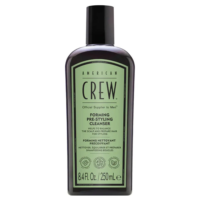 American Crew shampoo bottle on a white background