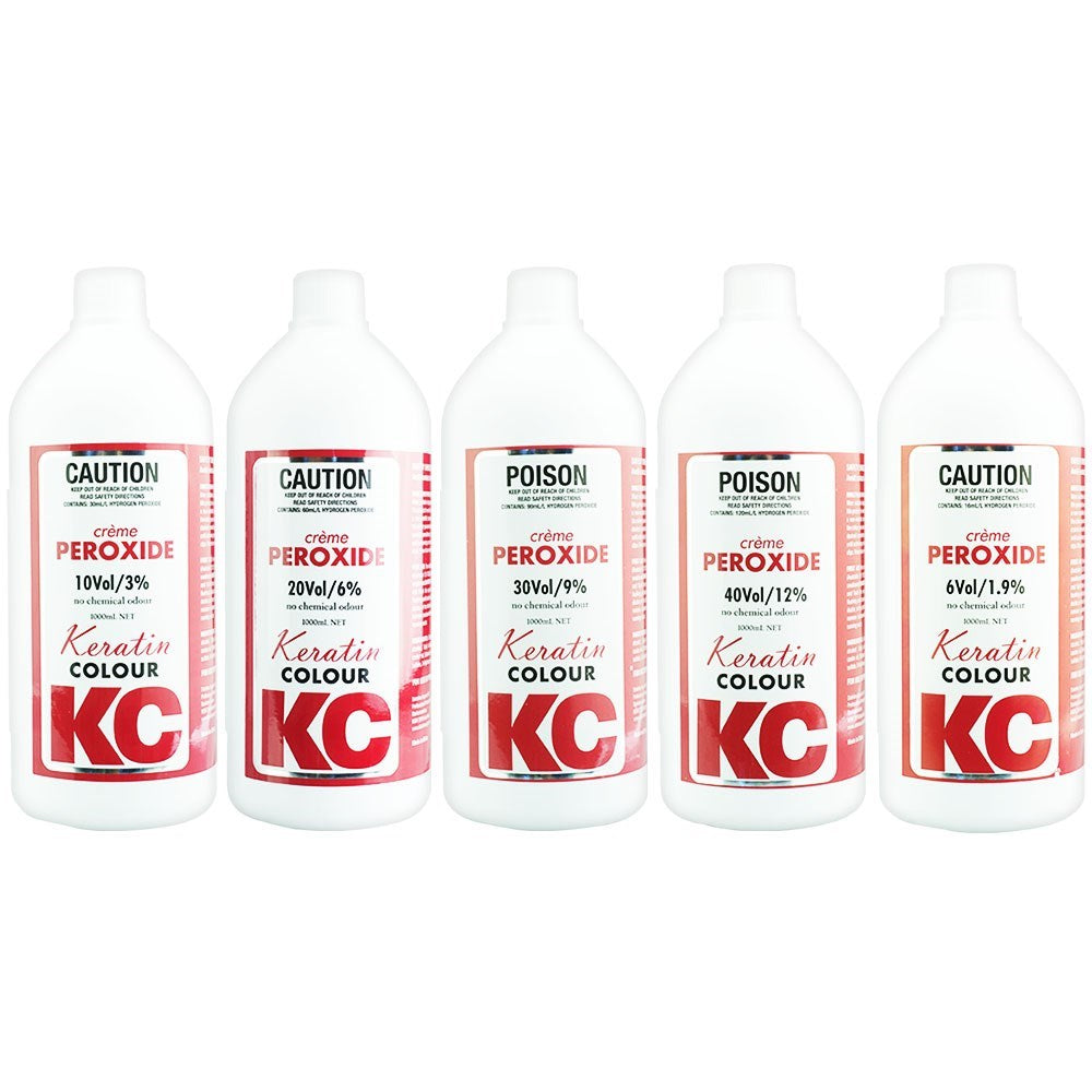 Five bottles of KC Keratin Colour crème peroxide with labels on a white background